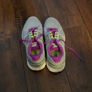 Women Nike tennis shoes purple and gray worn a couple of time good condition